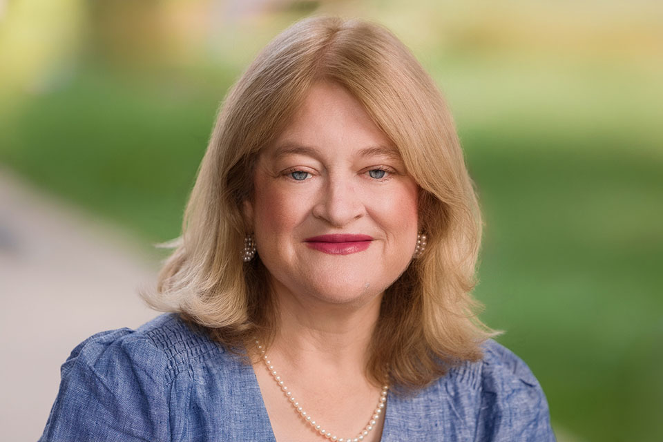 A headshot photo of Meg Connolly outside on campus.