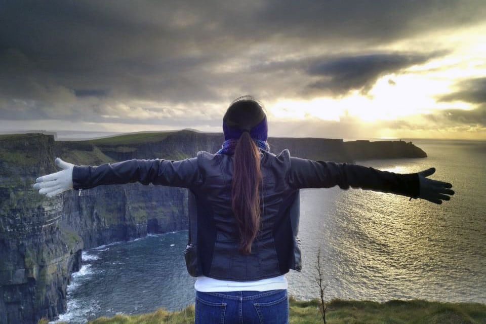 Study abroad student looks out a landscape