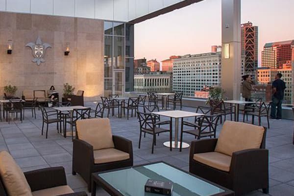 The outdoor pavilion and seating area on the 12th floor of Scott Hall. Soft seating and full tables and chairs are seen. 