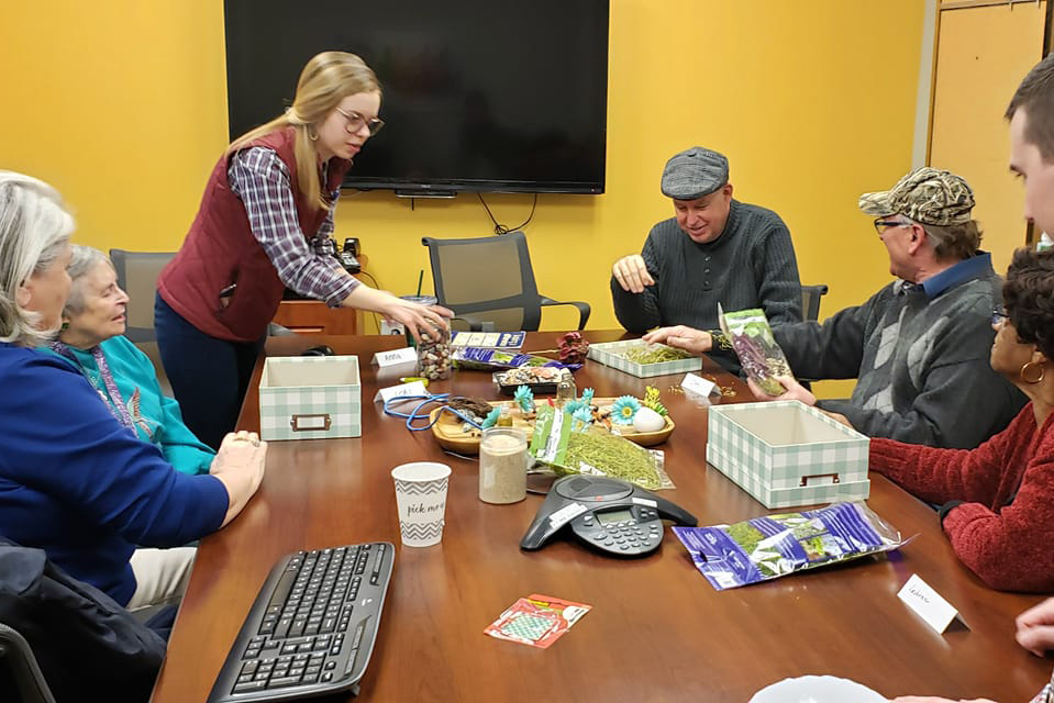 A group of seniors interacting with each other at the Aging and Memory Clinic