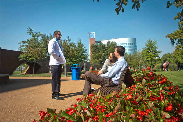 Students sitting outside outside Doisy Research Center