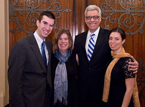 The Pestello family poses outside the doors of St. Francis Xavier College Church after the inauguration Mass. From left: Freddie, Fran, Fred and Vitina